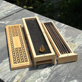 Ambergris Incense blended with nearly 20 distinct natural botanicals. 11 incense sticks, bronze stand in two tiered wood box (pick up at store only)
