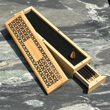 Ambergris Incense blended with nearly 20 distinct natural botanicals. 11 incense sticks, bronze stand in two tiered wood box (pick up at store only)