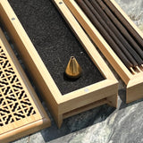 Ambergris Incense blended with nearly 20 distinct natural botanicals. 11 incense sticks, bronze stand in two tiered wood box (pick up at store only)